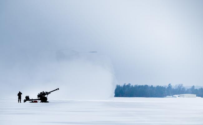 A soldier from the 1-120th Field Artillery Regiment, Wisconsin National Guard, watches as a CH-47 “Chinook” lands during Northern Strike 23-1, Jan. 24, 2023. (Source: U.S. Air National Guard photo by Master Sgt. Scott Thompson) Northern Strike